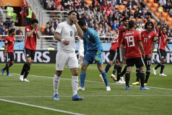 Uruguay&#039;s Luis Suarez covers his face after missing to score during the group A match between Egypt and Uruguay at the 2018 soccer World Cup in the Yekaterinburg Arena in Yekaterinburg, Russia, F ...