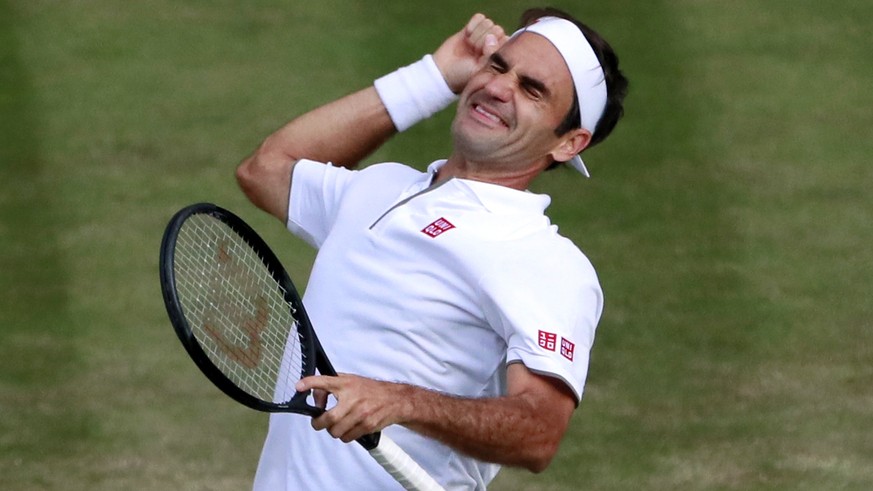 epa07713112 Roger Federer of Switzerland celebrates his win over Rafael Nadal of Spain in their semi final match during the Wimbledon Championships at the All England Lawn Tennis Club, in London, Brit ...