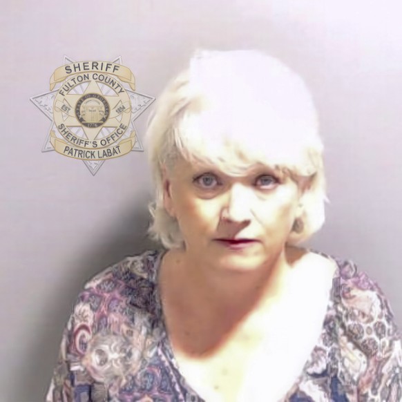 This booking photo provided by the Fulton County Sheriff&#039;s Office shows Cathleen Latham on Wednesday, Aug. 23, 2023, in Atlanta, after she surrendered and was booked. Latham is charged alongside  ...
