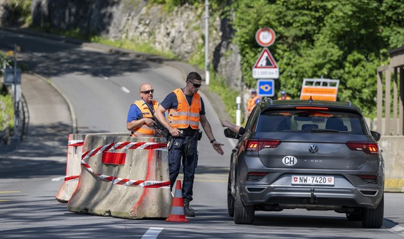 epa11408244 Security Police at a checkpoint on the mountain road Buergenstockstrasse in Stansstad, ahead of the &#039;Summit on Peace in Ukraine&#039; at the Buergenstock Resort, in Obbeurgen, Switzer ...