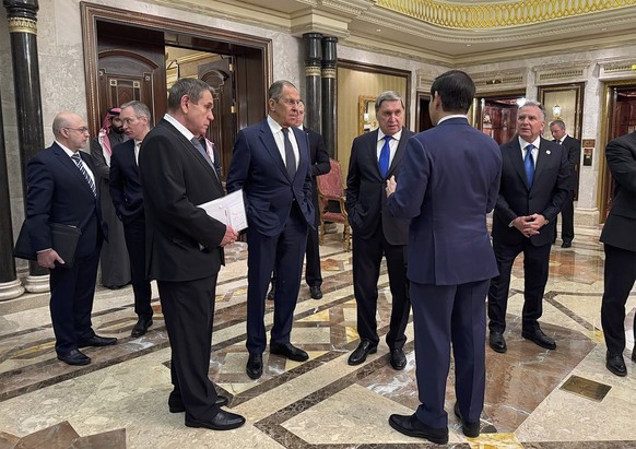 epa11904427 A handout photo made available by the Russian Foreign Ministry Press Service shows Russian Foreign Minister Sergey Lavrov (4-L) and Russian presidential aide Yury Ushakov (C) speak with U. ...