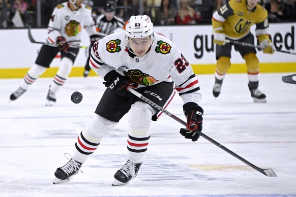 Chicago Blackhawks center Philipp Kurashev (23) skates for the puck during the third period of the team&#039;s NHL hockey game against the Vegas Golden Knights on Saturday, Jan. 8, 2022, in Las Vegas. ...