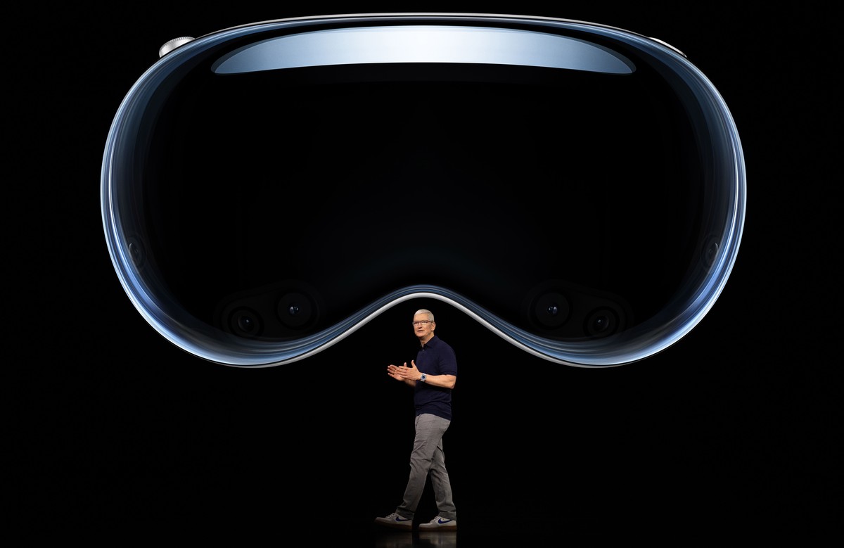 epa10675042 A handout photo made available by Apple showing Apple CEO Tim Cook introducing the Apple Vision Pro during the keynote address for the 2023 Apple Worldwide Developers Conference (WWDC) on  ...