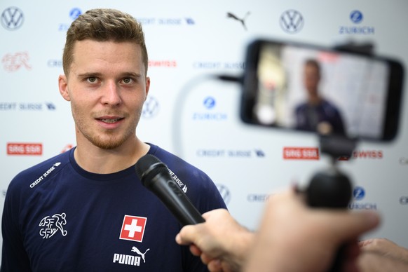 Switzerland&#039;s defender Nico Elvedi speaks to journalists during a mixed zone after a totally closed training session of Swiss national soccer team in preparation for the FIFA World Cup Qatar 2022 ...