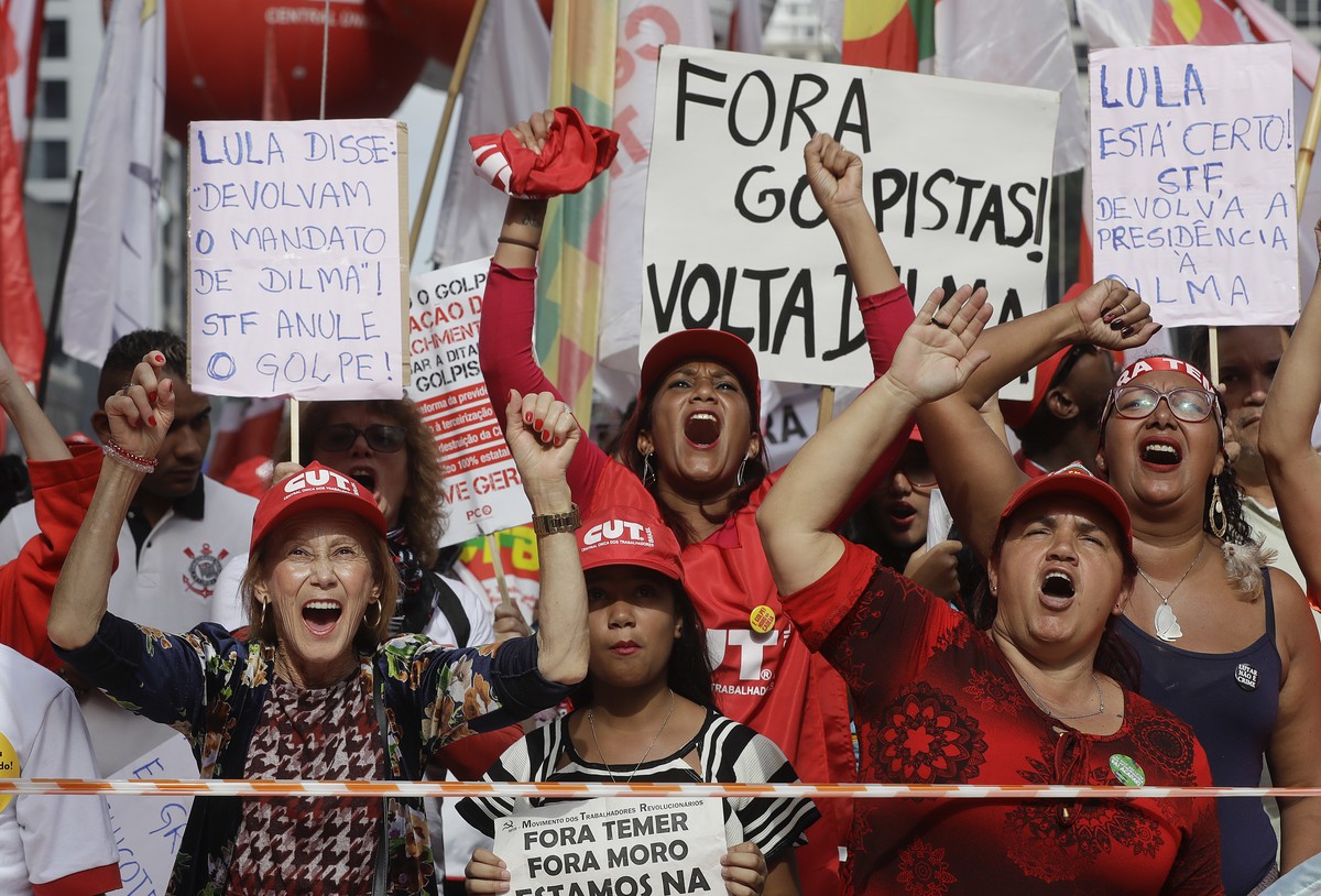 Demonstrators shout slogans against Brazil's President Michel Temer during a May Day rally in Sao Paulo, Brazil, Monday, May 1, 2017. (AP Photo/Andre Penner)