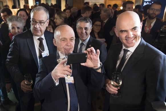 From left, Swiss Federal Councillor Guy Parmelin, Swiss Federal President Ueli Maurer, Swiss Federal Councillor Ignazio Cassis and Swiss Federal Councillor Alain Berset taking pictures during the open ...