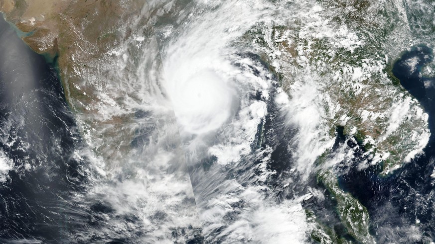 This Tuesday, May 19, 2020, satellite image released by NASA shows Cyclone Amphan over the Bay of Bengal in India. The powerful storm is expected to make landfall on Wednesday afternoon, May 20, 2020, ...