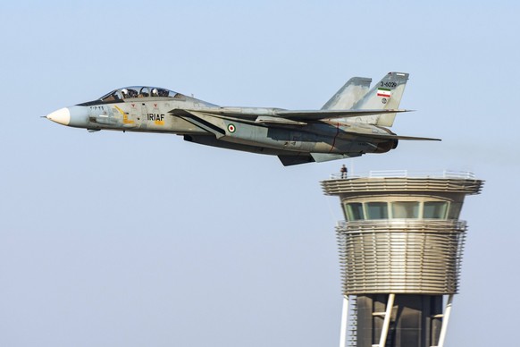 An F-14A Tomcat of the Islamic Republic of Iran Air Force IRIAF, low flying by an air traffic control tower. The last flying F-14As operate from Isfahans Shahid Babaei 8th Tactical Air Base Copyright: ...