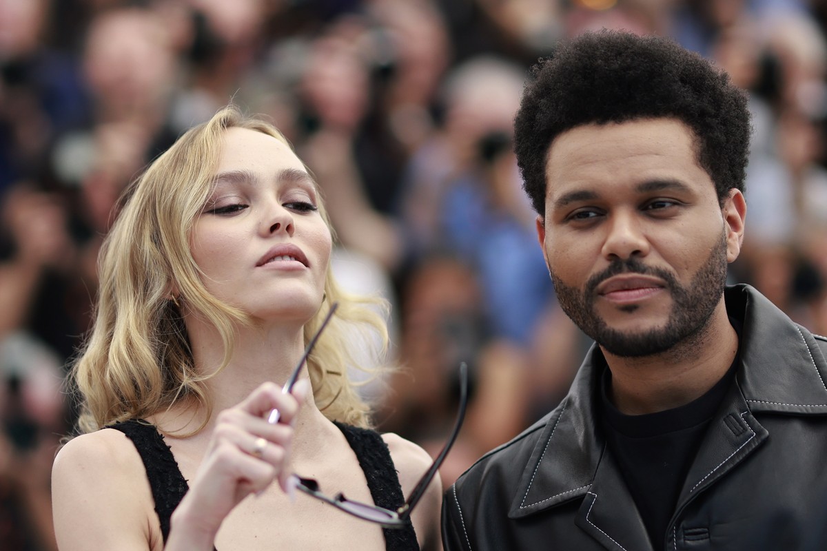 epa10647656 French-American actor Lily-Rose Depp (L) and Canadian singer-songwriter and actor Abel Tesfaye aka The Weeknd attend the photocall for 'The Idol' during the 76th annual Cannes Fi ...