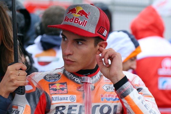 epa06973574 Spanish MotoGP rider Marc Marquez of the Repsol Honda Team on the grid before the MotoGP race of the 2018 Motorcycling Grand Prix of Britain at the Silverstone race track, Northampton, Bri ...