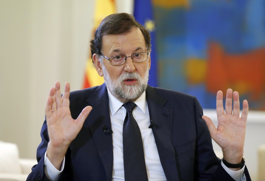 epa06246590 Spanish Prime Minister Mariano Rajoy gestures during an interview with Spanish News Agency Agencia EFE, at La Moncloa Palace in Madrid, Spain, 05 October 2017. Rajoy demanded from Cataloni ...
