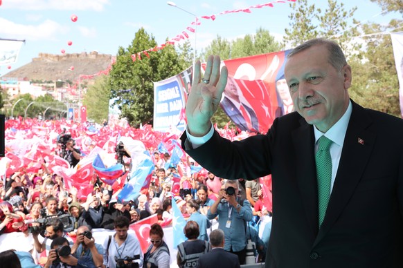 epa06940777 A handout photo made available by Turkish President Press Office shows Turkish President Tayyip Erdogan greeting supporters after the Friday prayer in Bayburt city, Turkey, 10 August 2018. ...