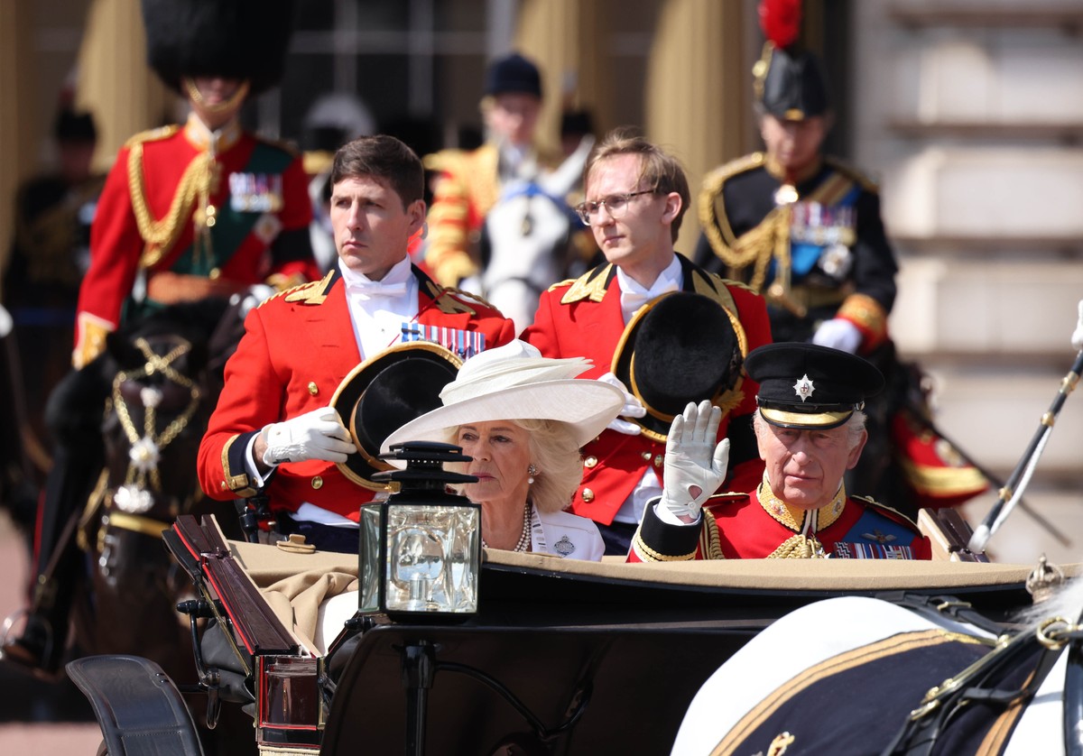 epa12174786 Britain?s King Charles III (R) and Queen Camilla (L) ride in a carriage during the Trooping the Colour ceremony in London, Britain, 14 June 2025. The King's birthday parade, tradition ...