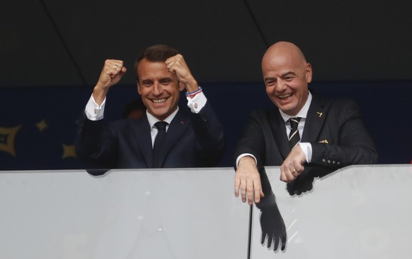 French President Emannuel Macron, left, and FIFA President Gianni Infantino in the stands prior to during the final match between France and Croatia at the 2018 soccer World Cup in the Luzhniki Stadiu ...