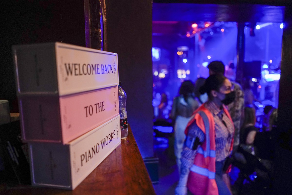 A message is displayed at the entrance of The Piano Works in Farringdon, in London, Monday, July 19, 2021. Thousands of young people plan to dance the night away at 'Freedom Day' parties aft ...