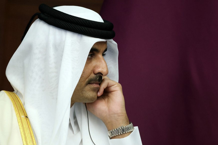 FILE - The Emir of Qatar, Sheikh Tamim bin Hamad Al Thani reacts during a meeting, in Astana, Kazakhstan, Thursday, Oct. 13, 2022. Sheikh Tamim bin Hamad Al Thani, channeled the wider anger in the Ara ...