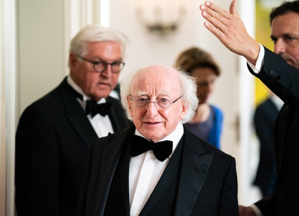 epa07693046 German President Frank-Walter Steinmeier (L) and Irish President Michael D. Higgins (R) attend a gala dinner given by German president at Bellevue Palace in Berlin, Germany, 03 July 2019.  ...