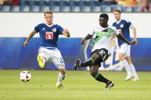Alfred Joseph Duncan, right, of Sassuolo, and Nicolas Haas, left, of Luzern, during the UEFA Europa League third qualifying round first leg soccer match between Swiss Club FC Luzern and Italian Club U ...