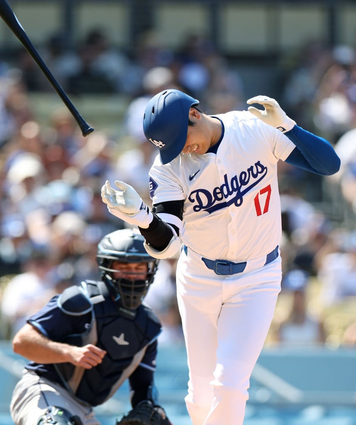 Los Angeles, California August 25, 2024-Dodgers Shohei Ohtani gets hit in the hand by a pitch against the Devil Rays in the eighth inning at Dodger Stadium Sunday. (Skalij/Los Angeles Times via Getty  ...