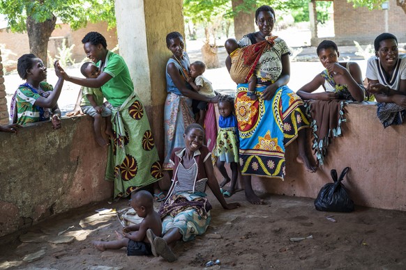 FILE - In this photo taken on Dec. 11, 2019, residents of the Malawi village of Tomali wait to have their young children become test subjects for the world&#039;s first vaccine against malaria. The U. ...