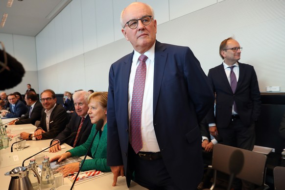 epa07045654 The parliamentary group leader of the ruling CDU/CSU faction, Volker Kauder (C), stands next to German Chancellor Angela Merkel (C-L) prior to a joint meeting of the Christian Democratic U ...