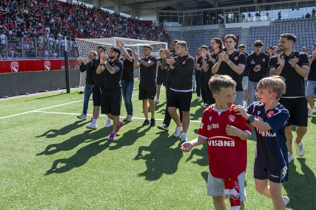 Thun's player and staff member react before they watch TV the soccer game between Young Boys Bern and FC St. Gallen, at the Stockhorn Arena, in Thun, Switzerland, on Sunday April 26, 2026. If St. ...