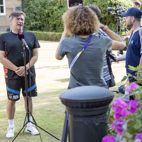 Switzerland&#039;s head coach Nils Nielsen talks to the TV reporter in the garden of the hotel Oulton Hall during a press conference after the elimination of the Swiss team at the UEFA Women&#039;s Eu ...