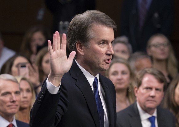 FILE - In this Sept. 4, 2018, file photo, President Donald Trump&#039;s Supreme Court nominee Brett Kavanaugh is sworn in before the Senate Judiciary Committee on Capitol Hill in Washington. Both part ...