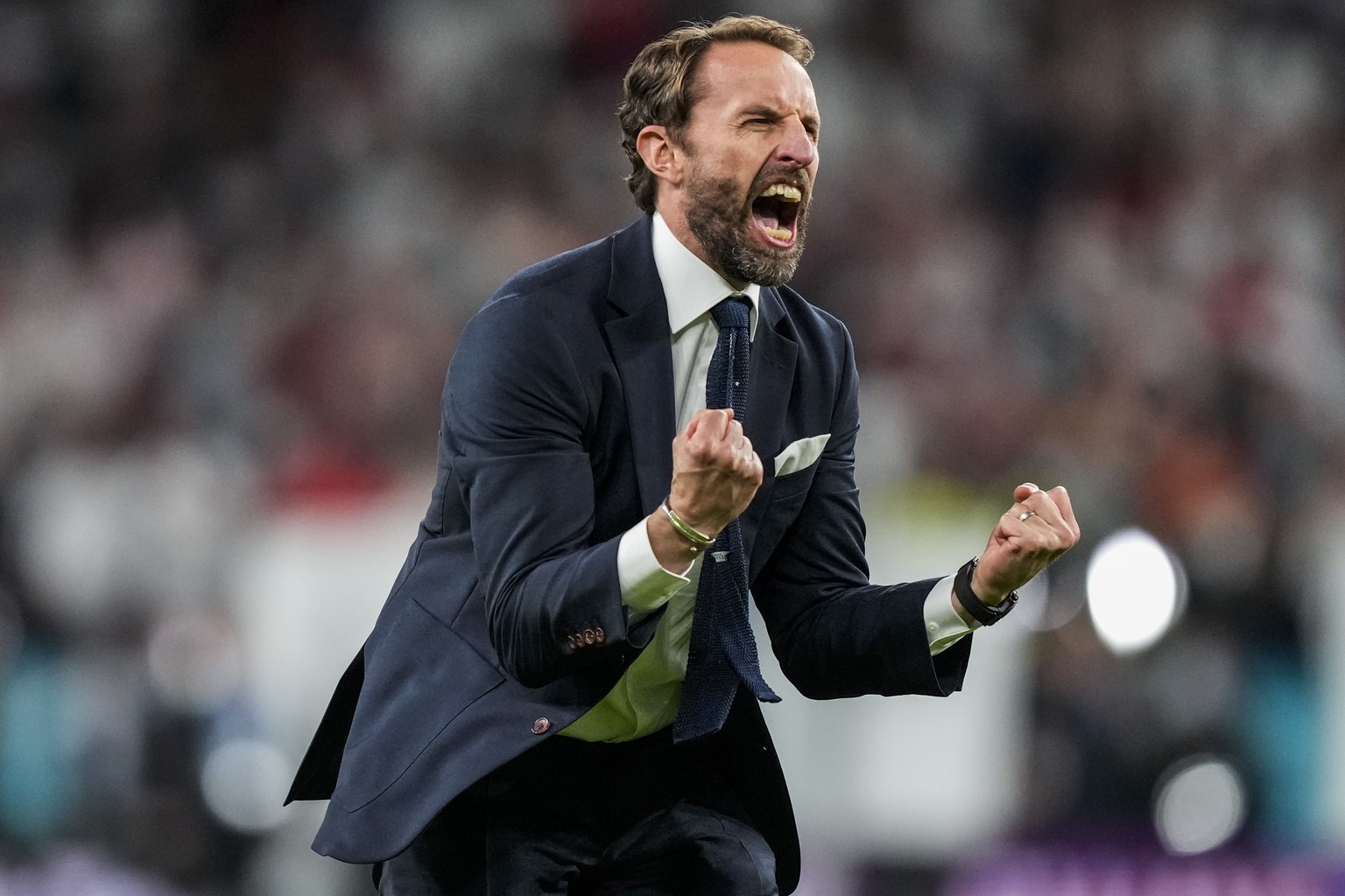 England&#039;s manager Gareth Southgate celebrates after winning the Euro 2020 soccer championship semifinal match against Denmark at Wembley stadium in London, Wednesday, July 7, 2021. (AP Photo/Fran ...