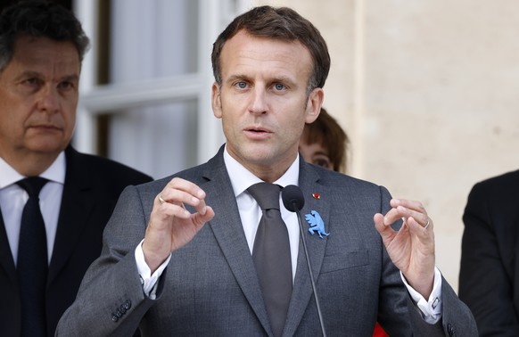 epa09318620 French President Emmanuel Macron (C) delivers a speech during the inauguration ceremony of the &#039;Made in France&#039; exhibition organised at the Elysee Presidential Palace in Paris, F ...