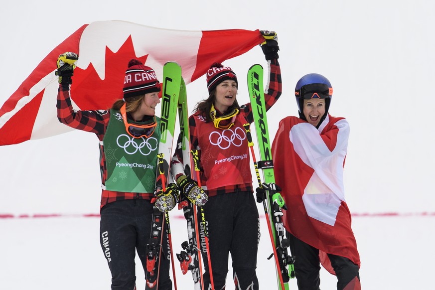 Silver medalist Brittany Phelan, Gold medalist Kelsey Serwa of Canada of Canada and bronze medalist Fanny Smith of Switzerland, from left, pose on the podium during the Women Freestyle Skiing Ski Cros ...