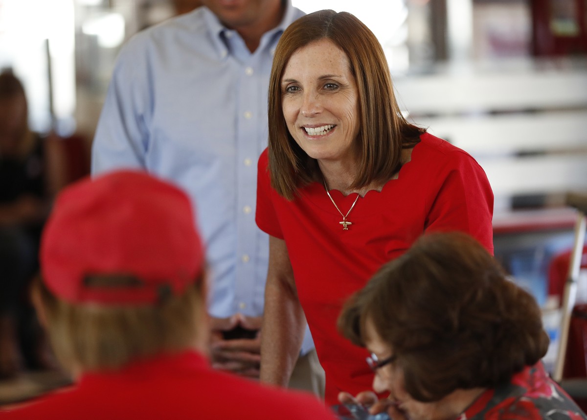 Arizona Republican senatorial candidate Martha McSally, speaks with voters, Tuesday, Nov. 6, 2018, at Chase's diner in Chandler, Ariz. McSally and Democratic challenger Kirsten Sinema are seeking ...