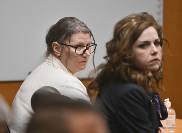 Defendant Jennifer Crumbley, left, and her attorney Shannon Smith react to the unanimous verdict of guilty of involuntary manslaughter on all counts at the conclusion of her trial in the courtroom of  ...
