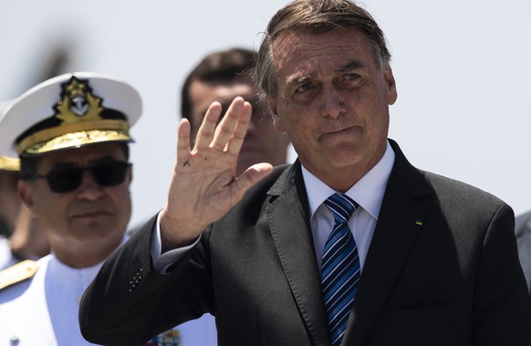 Brazil&#039;s President Jair Bolsonaro waves during the Naval Guard Declaration graduation ceremony, at the Naval School in Rio de Janeiro, Brazil, Saturday, Dec. 10, 2022. Bolsonaro presided over the ...