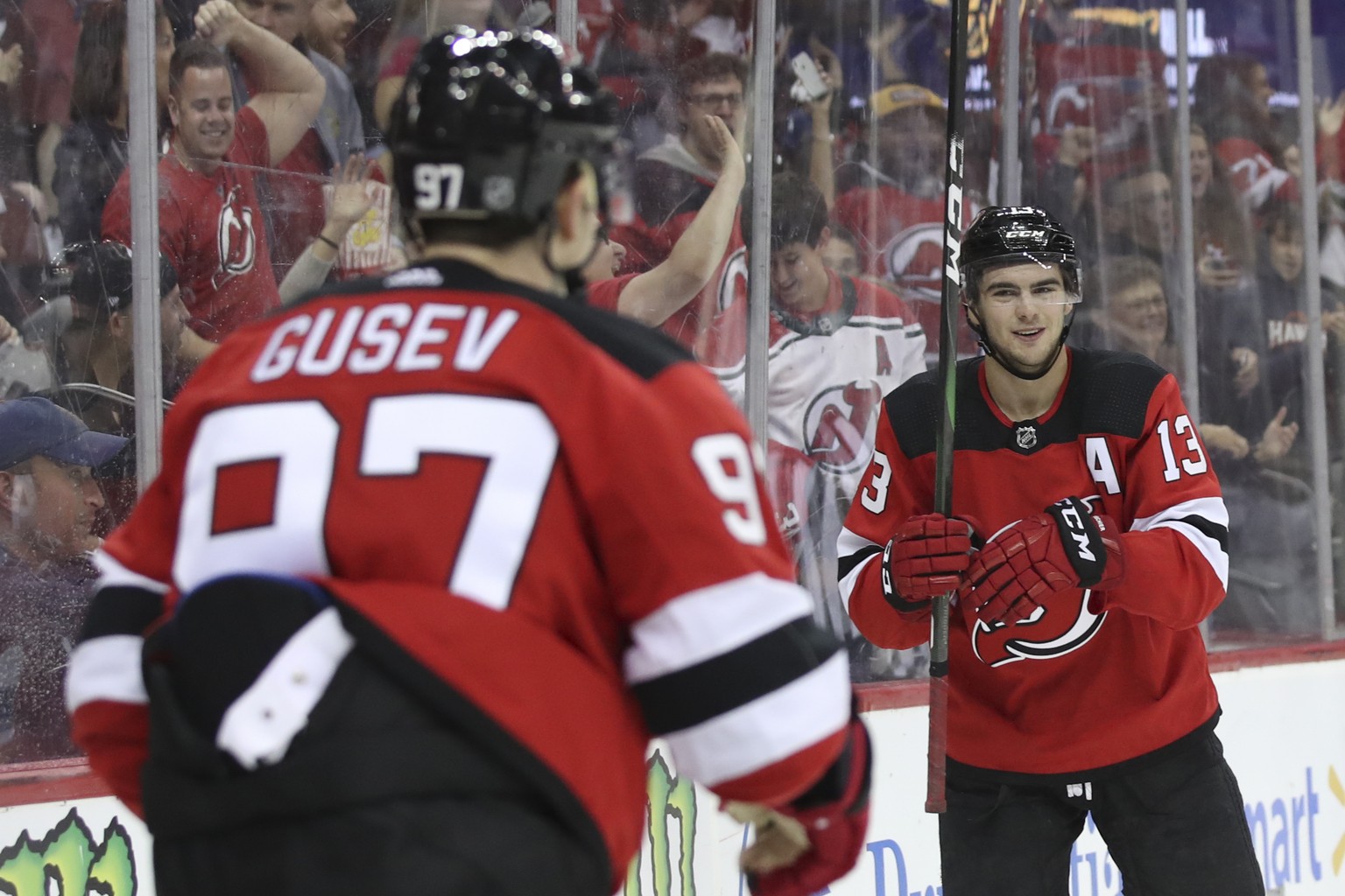 New Jersey Devils left wing Nikita Gusev (97) celebrates after scoring a goal with center Nico Hischier (13) during the second period of a preseason NHL hockey game, Saturday, Sept. 21, 2019, in Newar ...