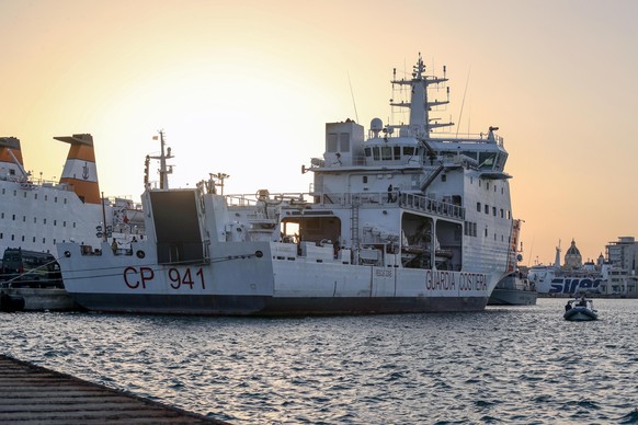 The Diciotti ship of the Italian Coast Guard, with 67 migrants on board rescued 4 days ago by the Vos Thalassa freighter, is moored in the Sicilian port of Trapani, southern Italy, Thursday, July 12,  ...