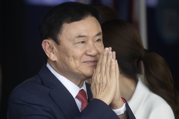 FILE - Thailand's former Prime Minister Thaksin Shinawatra greets supporters upon his arrival at Don Muang Airport in Bangkok, Thailand, on August 22, 2023. Prosecutors in Thailand say they...