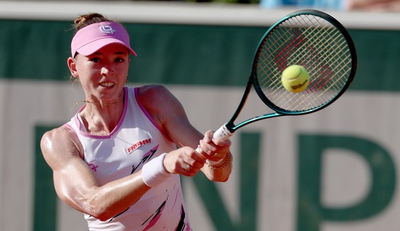epa12995632 Simona Waltert of Switzerland hits a backhand during her Women's 1st round match against Katerina Siniakova of the Czech Republic at the French Open Grand Slam tennis tournament at Ro ...