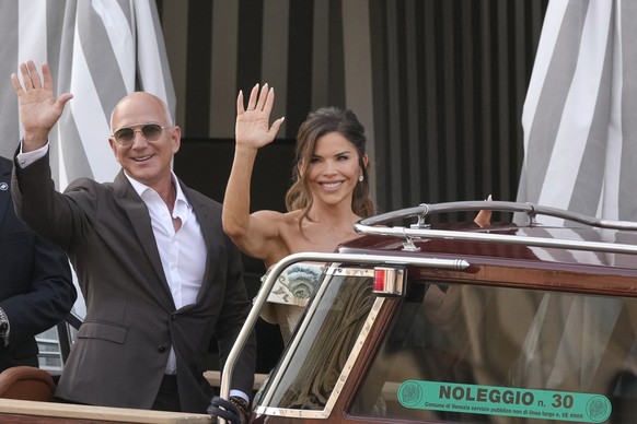 Jeff Bezos, left, and Lauren Sanchez leave a hotel for their pre wedding reception, in Venice, Italy, Thursday, June 26, 2025. (AP Photo/Luca Bruno)
Jeff Bezos,Lauren Sanchez