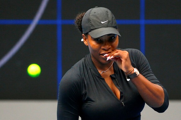 Serena Williams of the U.S. bites her finger during a training session ahead of the Australian Open tennis tournament in Melbourne, Australia, January 11, 2017. REUTERS/David Gray