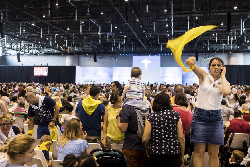 epa06827612 Pilgrims wait for Holy Mass of Pope Francis, inside the Palexpo hall, in Geneva, Switzerland, 21 June 2018. Pope Francis visit the World Council of Churches on 21 June as centrepiece of th ...