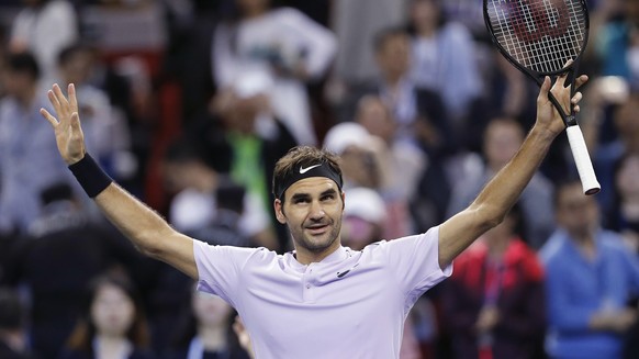 Roger Federer of Switzerland celebrates after winning his men&#039;s semifinals match against Juan Martin del Potro of Argentina in the Shanghai Masters tennis tournament at Qizhong Forest Sports City ...
