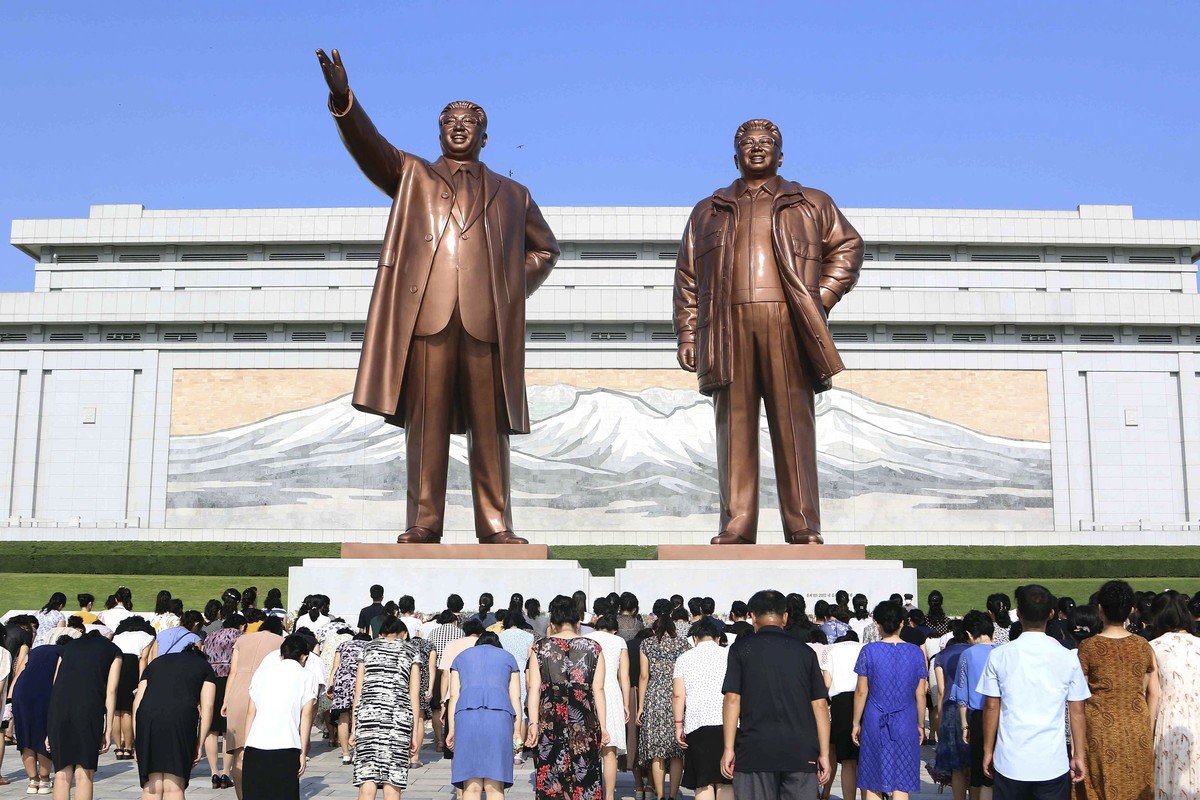 Pyongyang citizens visit the statues of their late leaders Kim Il Sung, left, and Kim Jong Il on Mansu Hill on the occasion of 79th anniversary of Korea's liberation in Pyongyang, North Korea Thu ...