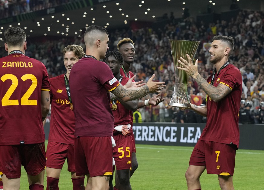 Roma players celebrate with the trophy after winning the Europa Conference League final soccer match between AS Roma and Feyenoord at National Arena in Tirana, Albania, Wednesday, May 25, 2022. AS Rom ...