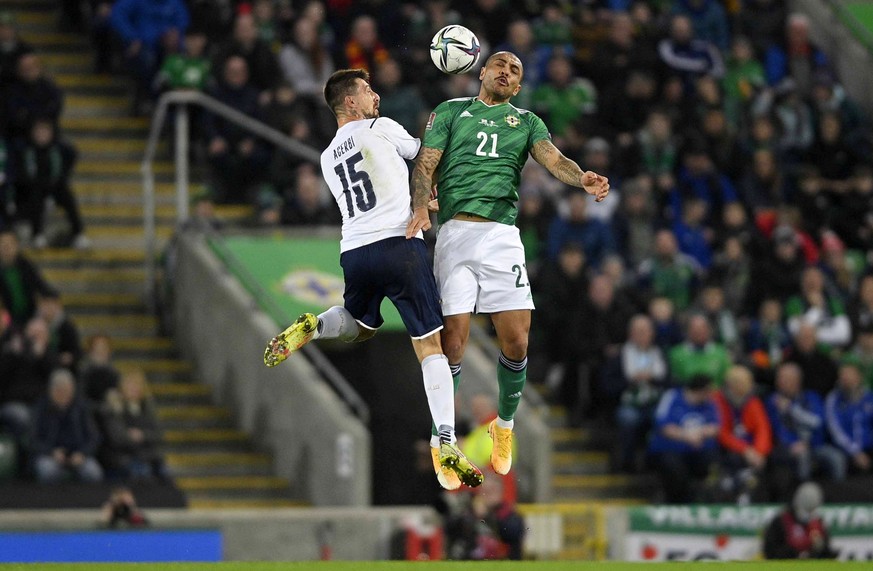 epa09583991 Northern Ireland&#039;s Josh Magennis (R) in action against Italy?s Francesco Acerbi (L) during the FIFA World Cup 2022 group C qualifying soccer match between Northern Ireland and Italy i ...