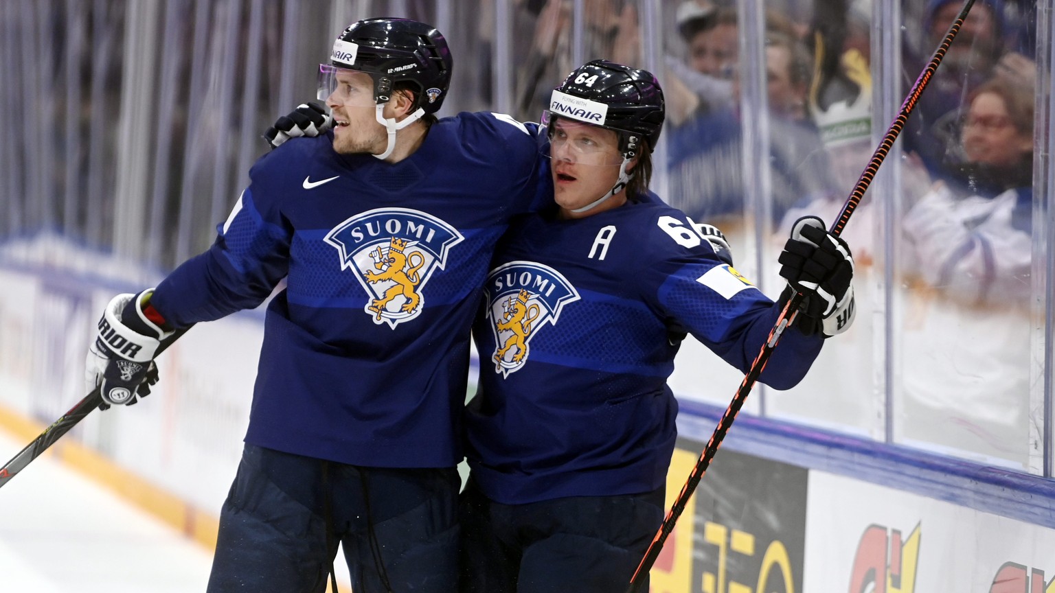 Assist Mikko Lehtonen and goal scorer Mikael Granlund, right, of Finland celebrate their 1-0 powerplay goal during the 2022 IIHF Ice Hockey World Championships preliminary round group B match between  ...