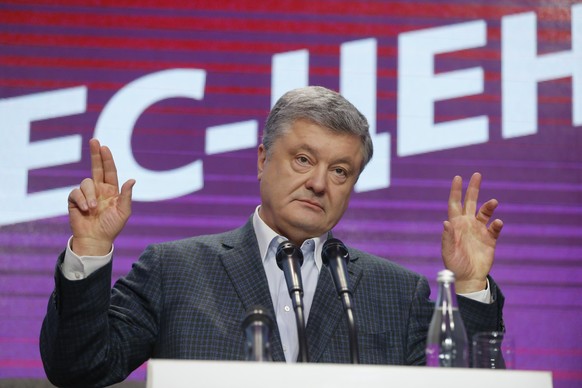 Ukrainian President Petro Poroshenko gestures while speaking at his headquarters after the presidential election in Kiev, Ukraine, Sunday, March 31, 2019. The exit poll released Sunday after voting st ...