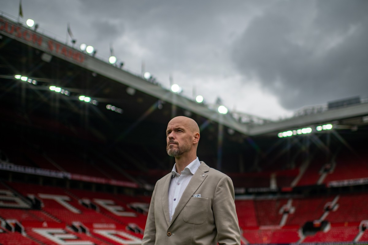 epa09969732 A handout photo made available by English Premier League club Manchester United of the new Manchester United manager, Erik ten Hag, during a press conference at Old Trafford, Manchester, B ...