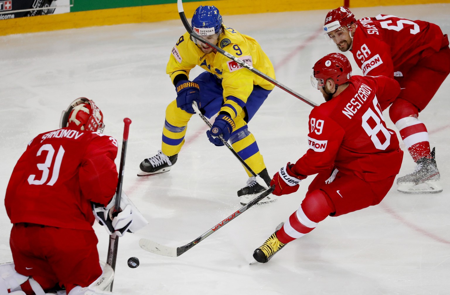 epa09239790 Adrian Kempe (C) of Sweden in action during the IIHF 2021 World Ice Hockey Championships group A match between Russia (ROC) and Sweden at the Olympic Sports Centre in Riga, Latvia, 31 May  ...