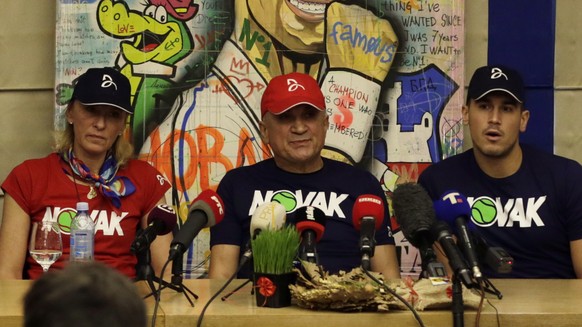 epa09669632 Serbian tennis player Novak Djokovic?s (2L-R) mother Diana, his father Srdjan and brother Djordje hold a press conference in Belgrade, Serbia, 06 January 2022. World No.1 tennis star Novak ...